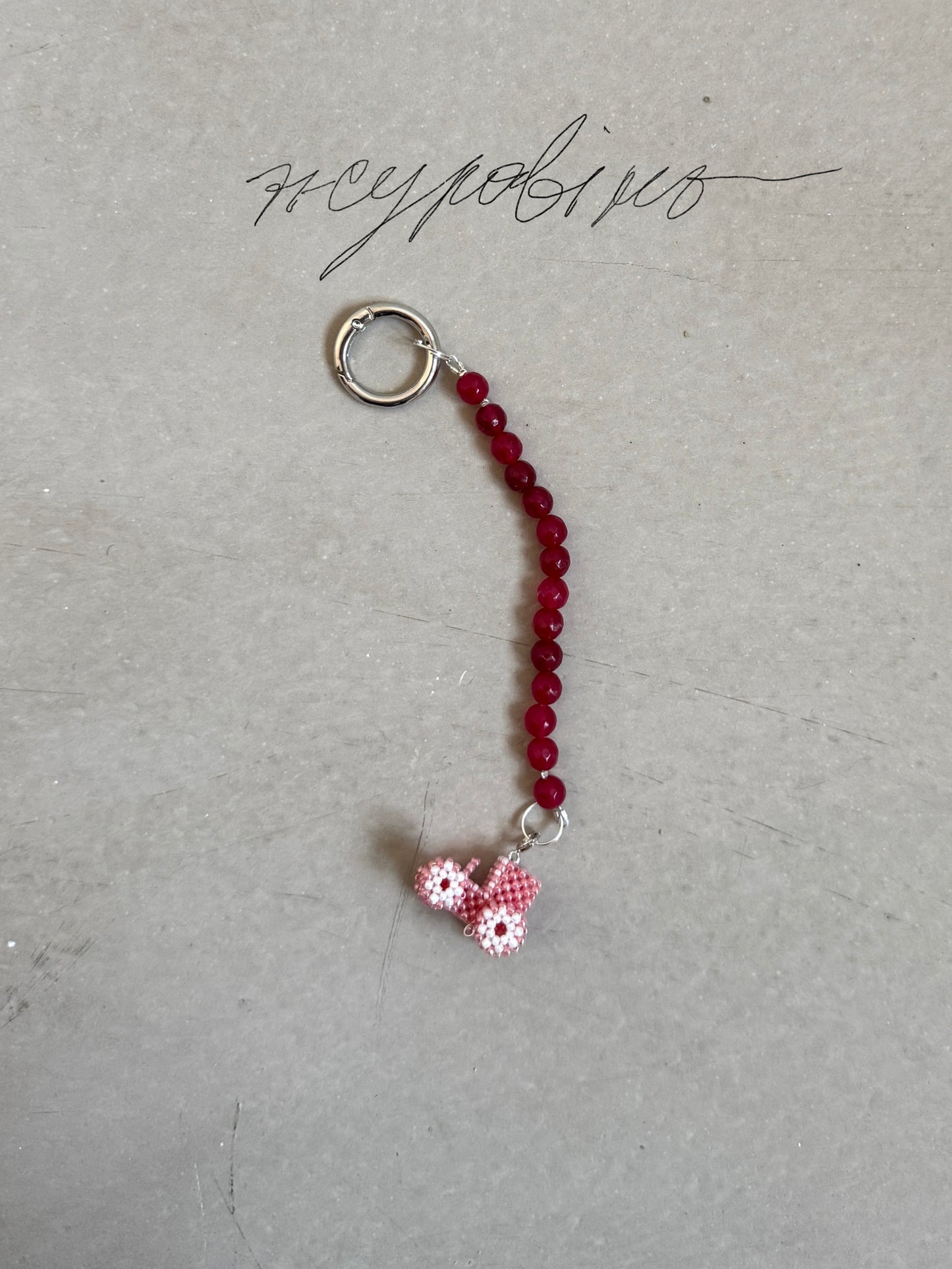 Keychain with clasp and a tractor (cranberry)