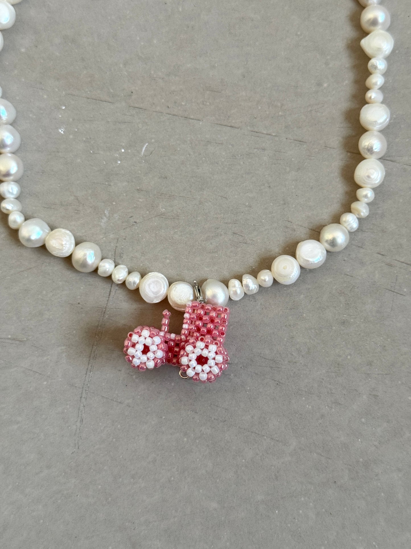 Pearl necklace with tractor