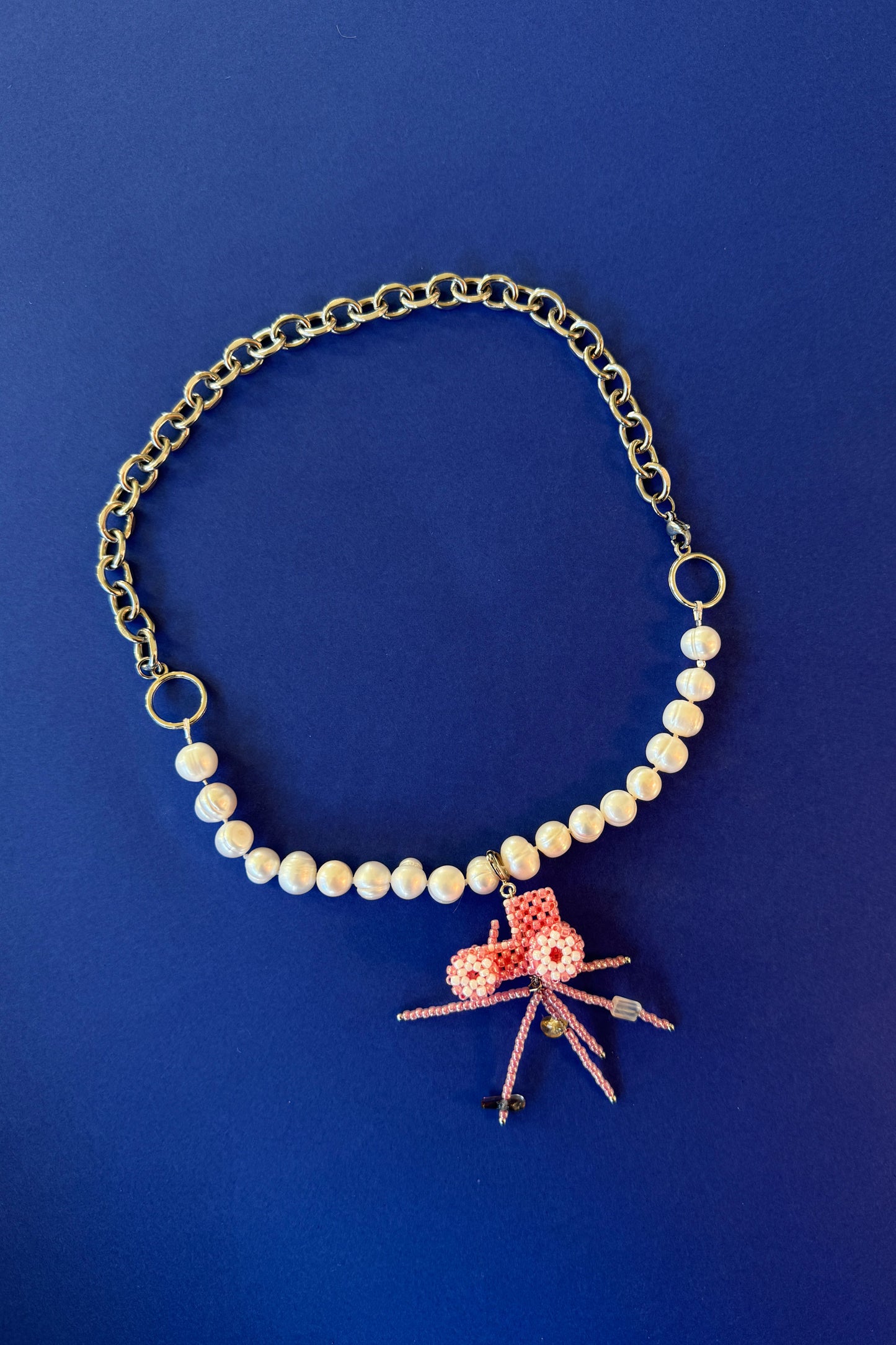 Pearl-steel necklace with a Tractor