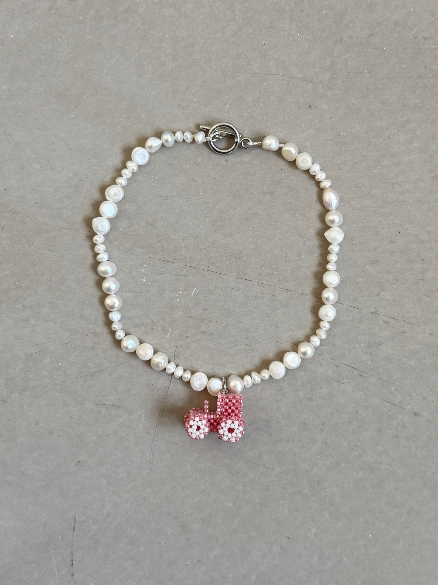 Pearl necklace with tractor
