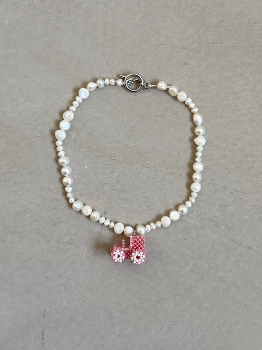 Pearl necklace with tractor
