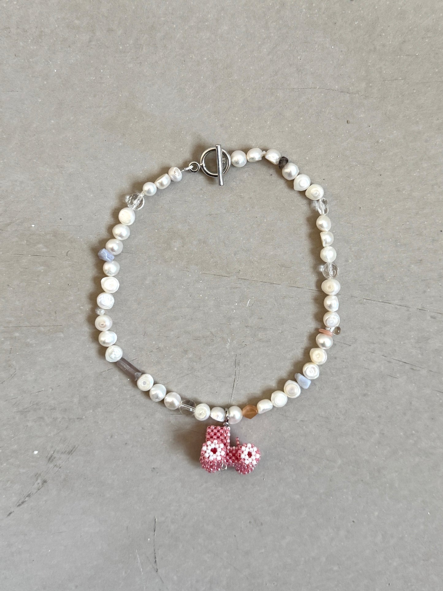 Pearl necklace with a mix stones and Tractor